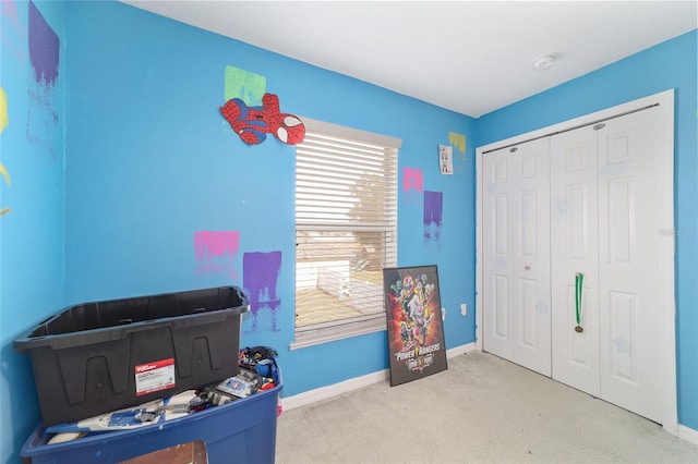 playroom featuring baseboards and carpet