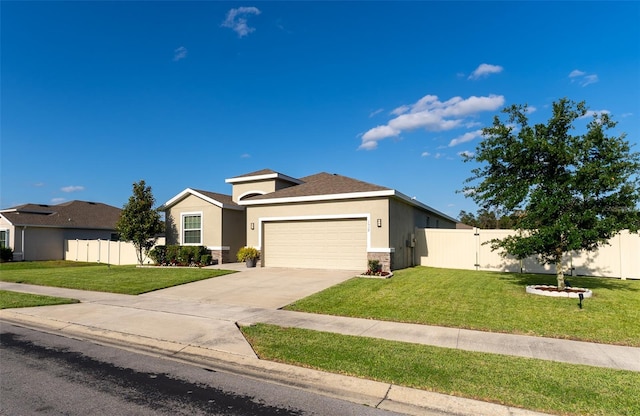 view of front of home featuring a garage, fence, a front yard, stucco siding, and concrete driveway