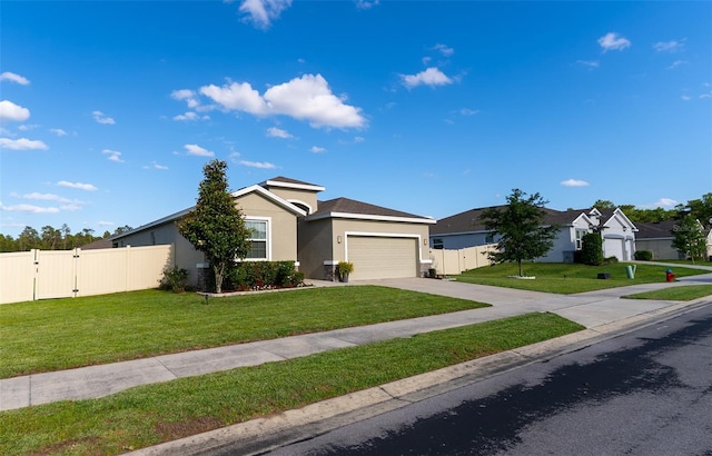 view of front of home with fence, an attached garage, stucco siding, a front yard, and a gate
