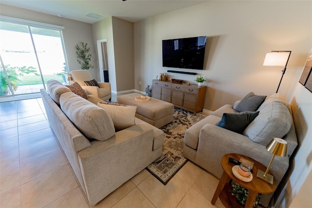 living room featuring visible vents and light tile patterned floors