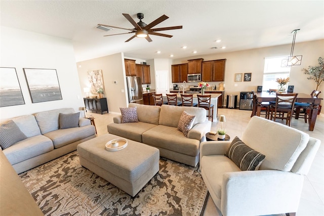 living area featuring a ceiling fan, recessed lighting, and visible vents