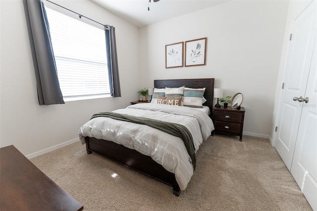 carpeted bedroom with baseboards