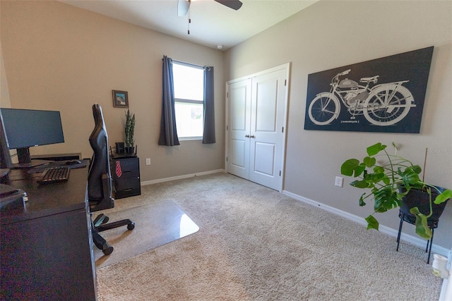 office featuring carpet floors, baseboards, and a ceiling fan
