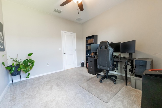 carpeted office with a ceiling fan, baseboards, and visible vents