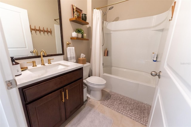 full bathroom featuring tile patterned floors, vanity, toilet, and shower / bath combination with curtain