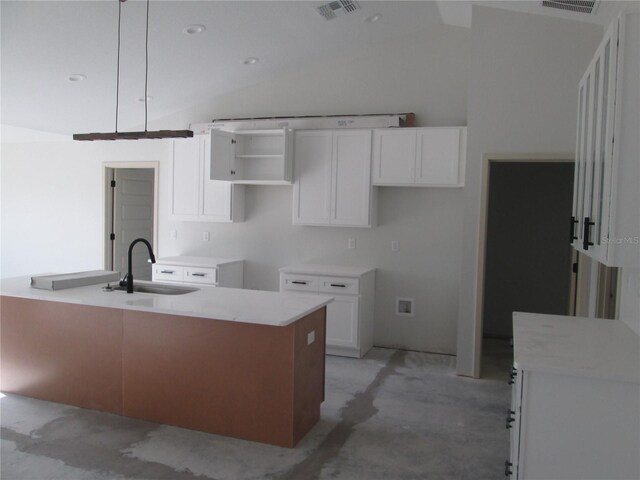 10409 SW 45th St, Ocala, FL 34481 - kitchen with a sink, vaulted ceiling, white cabinetry, and concrete floors