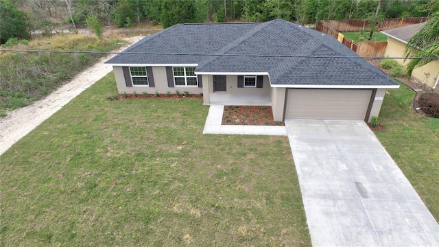 single story home featuring driveway, roof with shingles, a garage, fence, and stucco siding