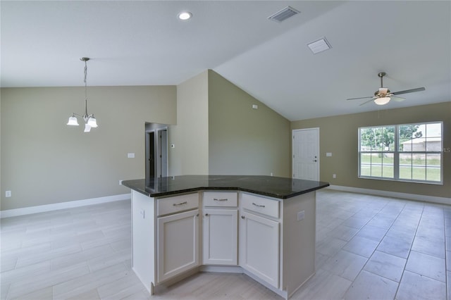 kitchen featuring visible vents, open floor plan, baseboards, and vaulted ceiling