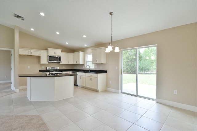 kitchen featuring visible vents, white cabinetry, appliances with stainless steel finishes, and dark countertops
