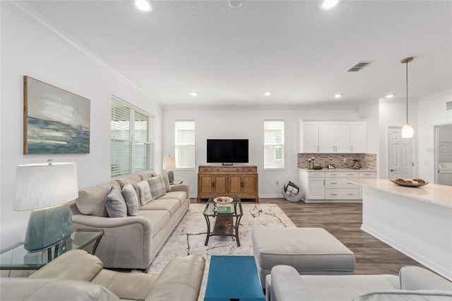 7706 SW 89th Ct, Ocala, FL 34481 - living room featuring recessed lighting, crown molding, dark wood finished floors, and visible vents