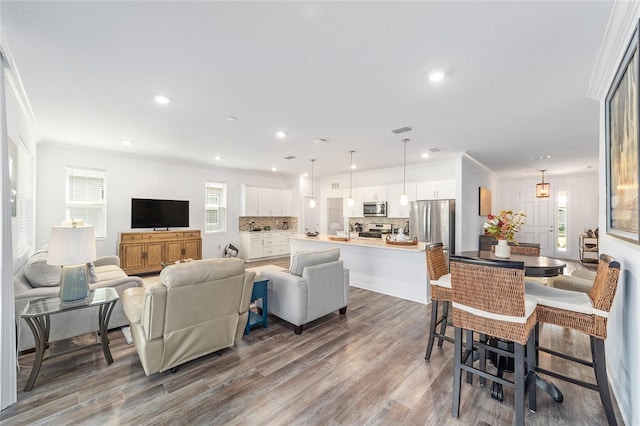 7706 SW 89th Ct, Ocala, FL 34481 - living area with recessed lighting, visible vents, and wood finished floors