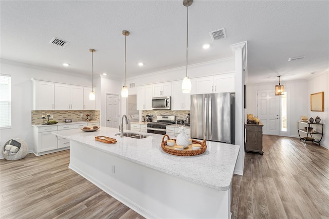 7706 SW 89th Ct, Ocala, FL 34481 - kitchen with a sink, white cabinets, visible vents, backsplash, and appliances with stainless steel finishes