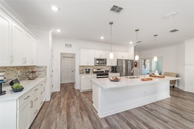 7706 SW 89th Ct, Ocala, FL 34481 - kitchen with decorative backsplash, visible vents, and appliances with stainless steel finishes