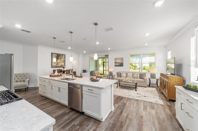 7706 SW 89th Ct, Ocala, FL 34481 - kitchen with ornamental molding, visible vents, stainless steel appliances, white cabinets, and dark wood-style floors