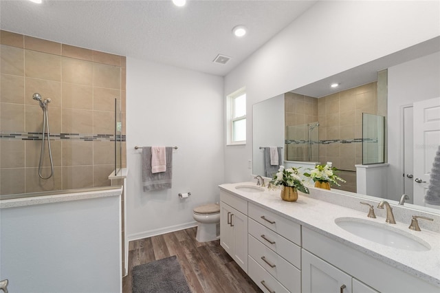 7706 SW 89th Ct, Ocala, FL 34481 - bathroom with wood finished floors, visible vents, a walk in shower, and a sink
