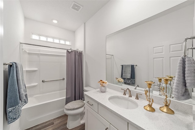 7706 SW 89th Ct, Ocala, FL 34481 - full bath featuring shower / bath combo with shower curtain, toilet, visible vents, vanity, and wood finished floors