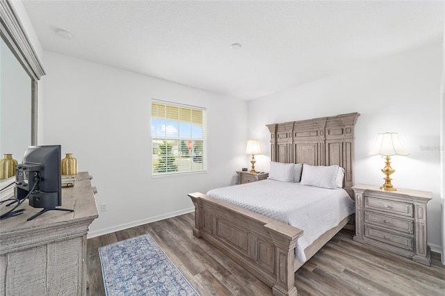 7706 SW 89th Ct, Ocala, FL 34481 - bedroom with baseboards and dark wood-style floors