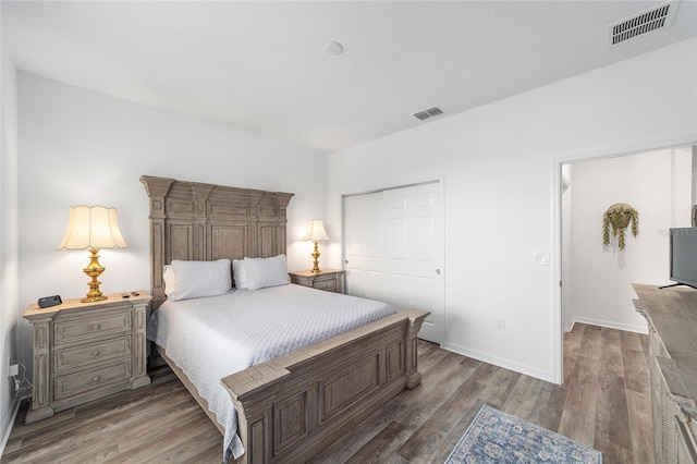 7706 SW 89th Ct, Ocala, FL 34481 - bedroom featuring a closet, baseboards, visible vents, and wood finished floors