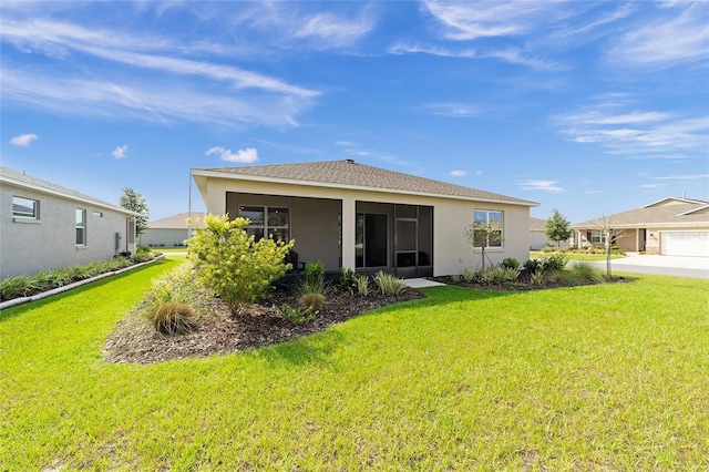 7706 SW 89th Ct, Ocala, FL 34481 - back of house featuring a yard, stucco siding, and a sunroom