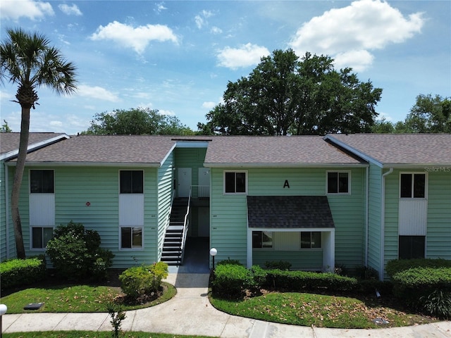 view of property featuring stairway