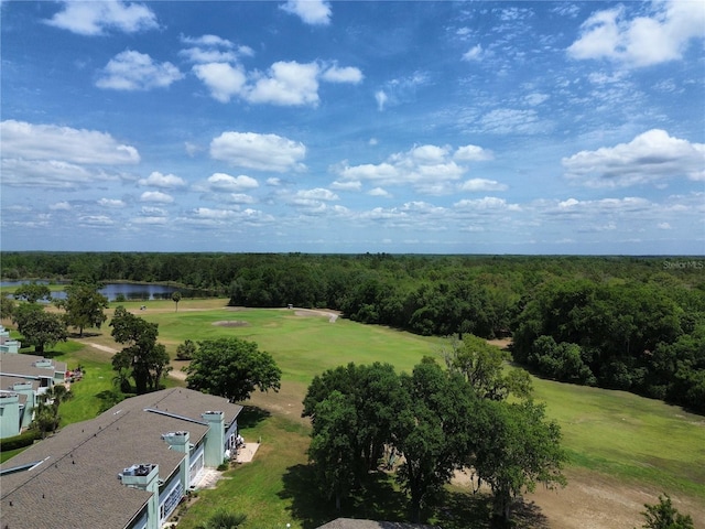 aerial view with a water view, a forest view, and golf course view