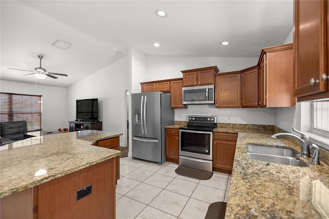 6306 Pecan Crse, Ocala, FL 34472 - kitchen featuring stainless steel appliances, a sink, lofted ceiling, ceiling fan, and brown cabinets
