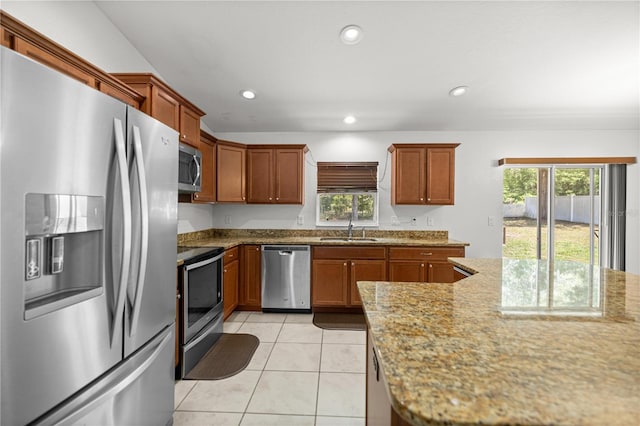 6306 Pecan Crse, Ocala, FL 34472 - kitchen with stainless steel appliances, a sink, healthy amount of natural light, light tile patterned floors, and recessed lighting