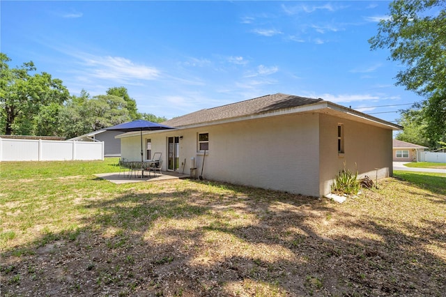 6306 Pecan Crse, Ocala, FL 34472 - back of property with stucco siding and a patio area