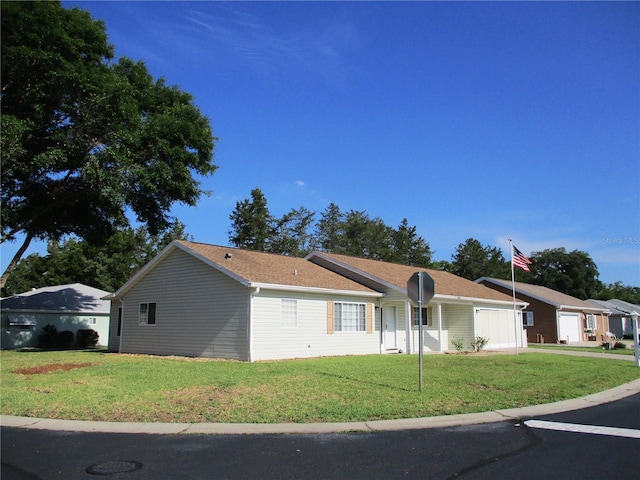 ranch-style house with a front yard