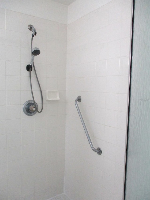 full bathroom with a tile shower