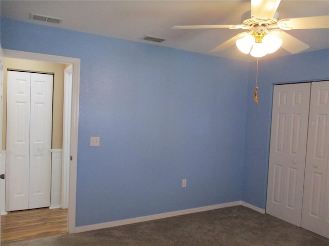 unfurnished bedroom with baseboards, ceiling fan, a closet, and visible vents