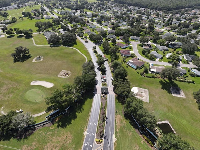 drone / aerial view with a residential view and golf course view