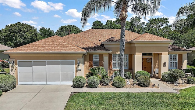 single story home with a garage, stucco siding, and driveway