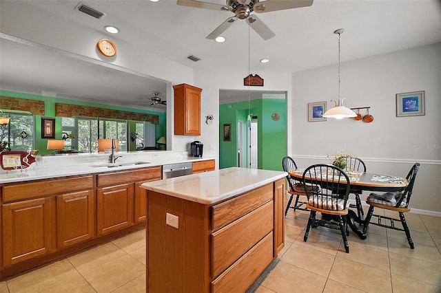 kitchen with visible vents, light countertops, and ceiling fan