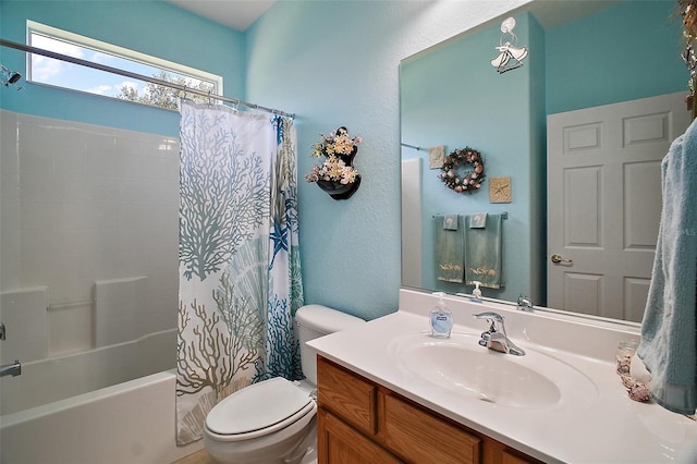full bathroom featuring vanity, shower / tub combo, and toilet