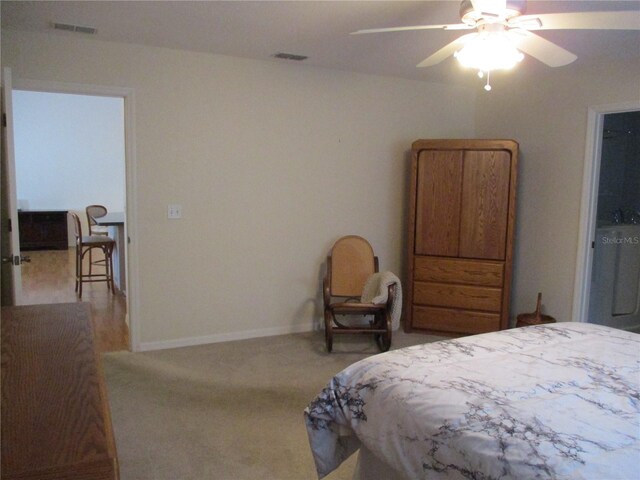 carpeted bedroom featuring baseboards, ceiling fan, and visible vents