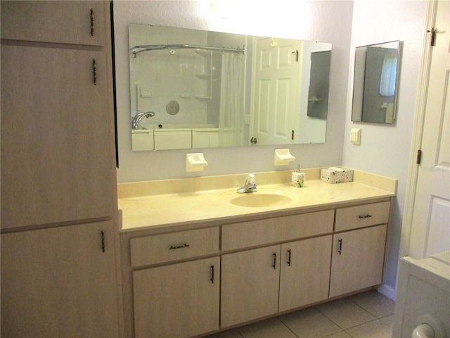 bathroom with a shower with curtain, tile patterned flooring, and vanity