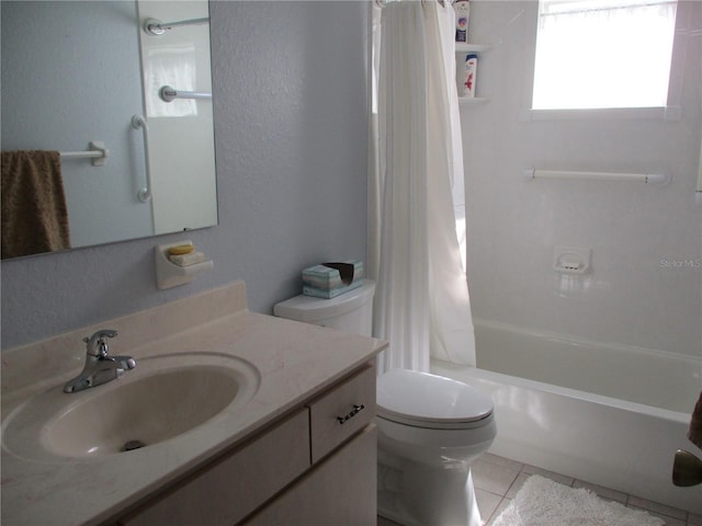 bathroom featuring toilet, tile patterned floors, shower / bath combo, and vanity