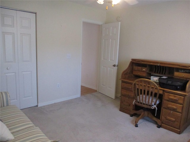 office area with baseboards, ceiling fan, and carpet flooring