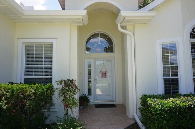 doorway to property with stucco siding