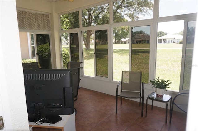 sunroom / solarium with tile patterned flooring