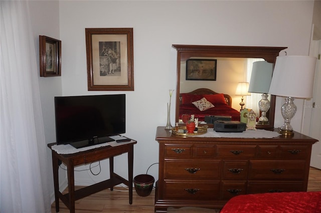 bedroom featuring wood finished floors