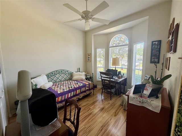 bedroom with ceiling fan and light wood-type flooring