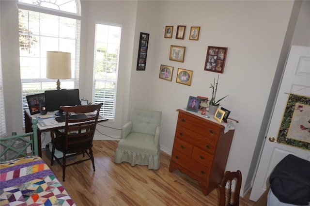 bedroom featuring baseboards and light wood-style floors