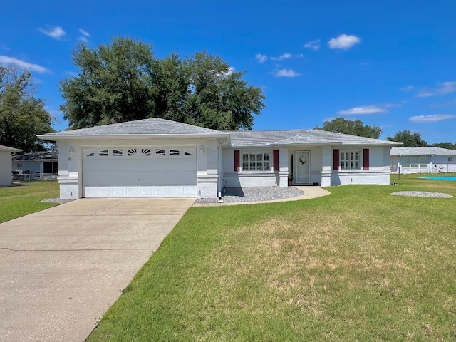 ranch-style home with a garage, driveway, a front yard, and stucco siding