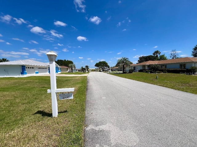 view of asphalt road featuring a residential view
