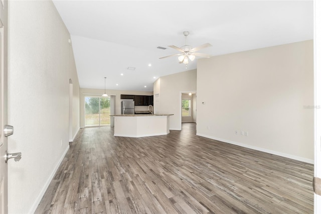 69 Juniper Trail Loop, Ocala, FL 34480 - unfurnished living room featuring a sink, wood finished floors, visible vents, ceiling fan, and baseboards