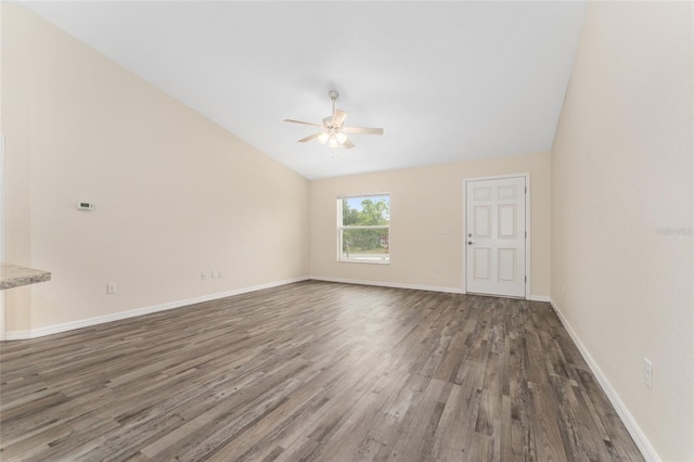 69 Juniper Trail Loop, Ocala, FL 34480 - spare room with baseboards, wood finished floors, a ceiling fan, and lofted ceiling