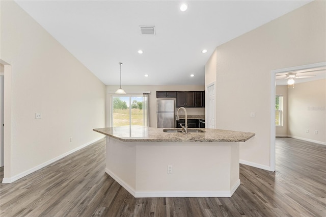 69 Juniper Trail Loop, Ocala, FL 34480 - kitchen with wood finished floors, a sink, freestanding refrigerator, visible vents, and a spacious island