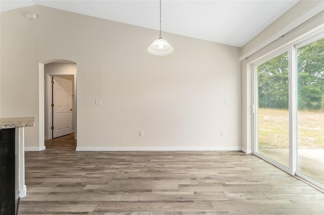69 Juniper Trail Loop, Ocala, FL 34480 - interior space with lofted ceiling, arched walkways, light wood-style flooring, and baseboards